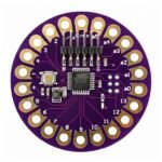 Arduino LilyPad ATmega328P Compatible Board with circular design, sew tabs, and central microcontroller