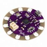 Arduino LilyPad ATmega328P board backside with PCB traces and stitchable connection pads