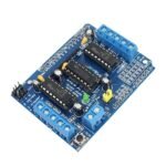 l293d motor driver IC chips mounted on shield with heat sink slots and screw terminals