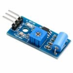 Vibration Sensor Module front view showing LM393 IC potentiometer and 3-pin header on white background