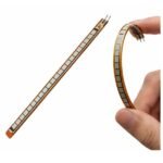 1mm thin flex sensor close-up showing carbon ink printed side and plain backing layer thickness