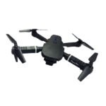 E88 Pro drone with dual camera capturing clear 1080p aerial shots outdoors.