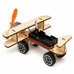 diy plane wooden parts including cut panels, propeller, and motor components arranged before assembly