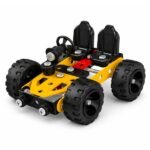hild assembling MECHANIX Basic Building and Construction Kit using hands to connect colorful plastic parts